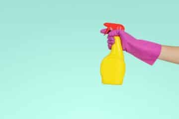 Spring cleaning, with a picture of a hand holding a yellow cleanser.